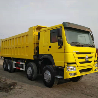 Sinotruk HOWO 8X4 371HP tweedehands gele dumptruck met handgeschakeld type
